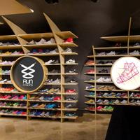 Customized creative wooden shoe cabinet for run shoes shop interior design
